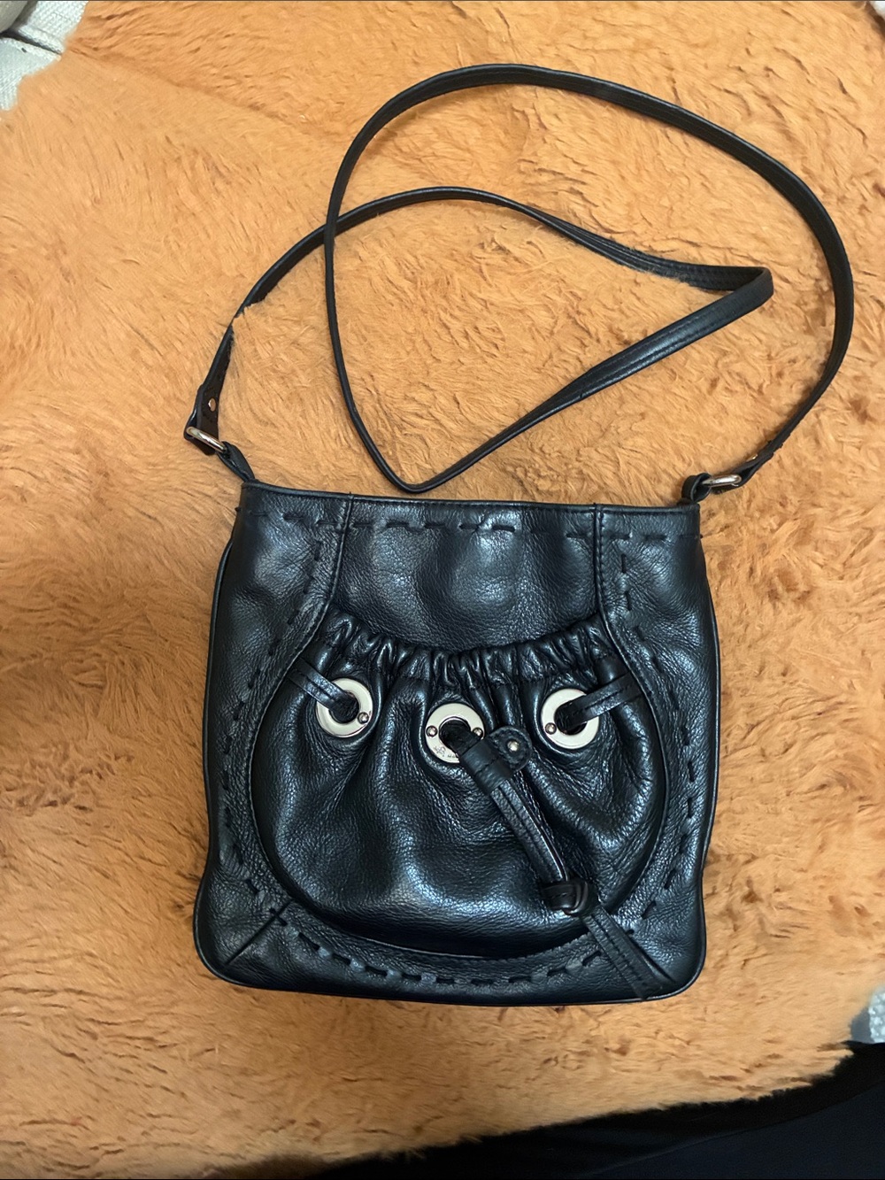 b. makowsky Black Leather Drawstring Crossbody Bag with Silver Eyelets